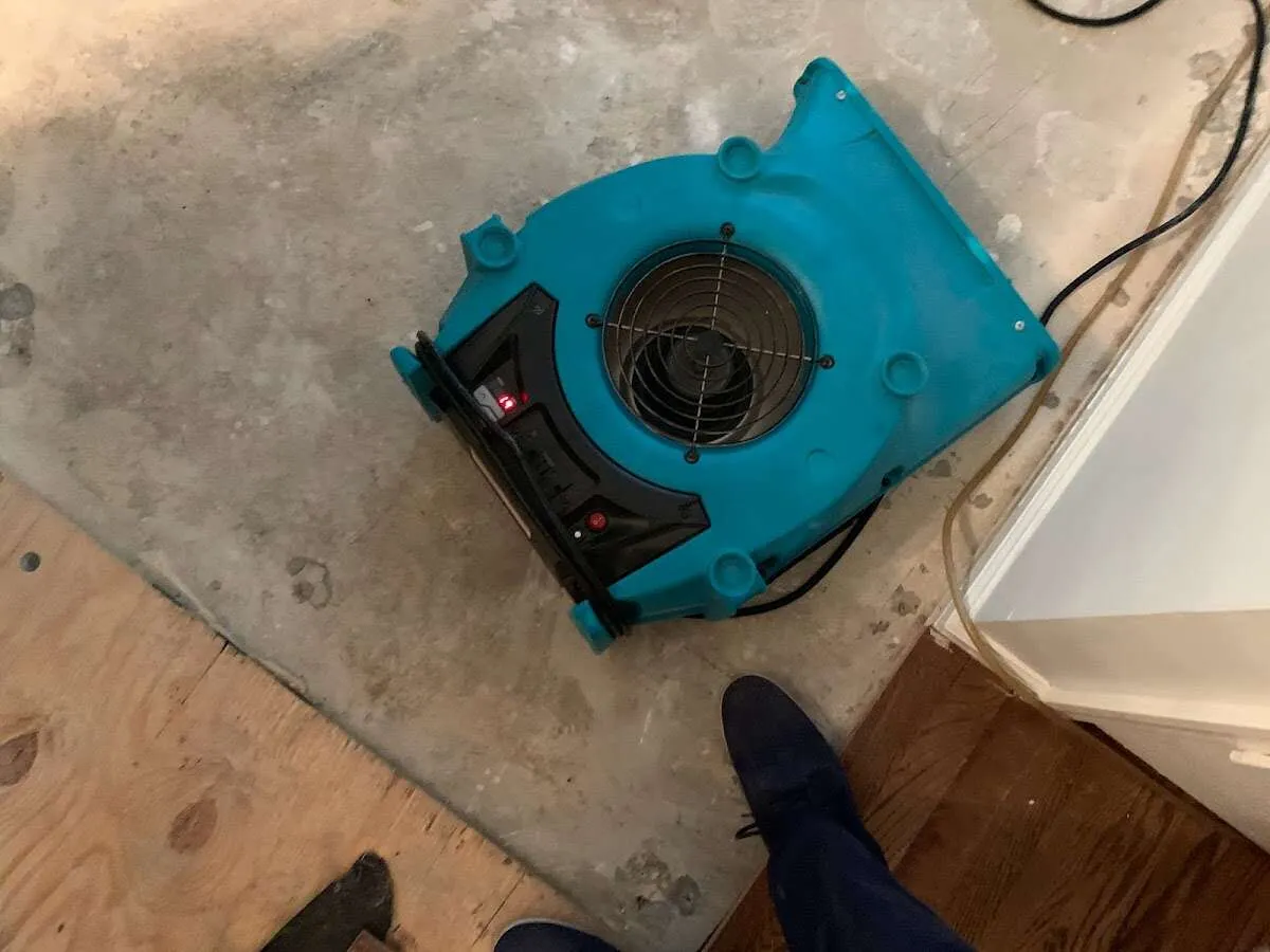 Air mover drying subfloor during Leak Detection & Repair in Gahanna